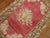 Gorgeous soft colored antique Turkish ghiordes rug with a floral open medallion design and floral border. 3'3'' x 5'