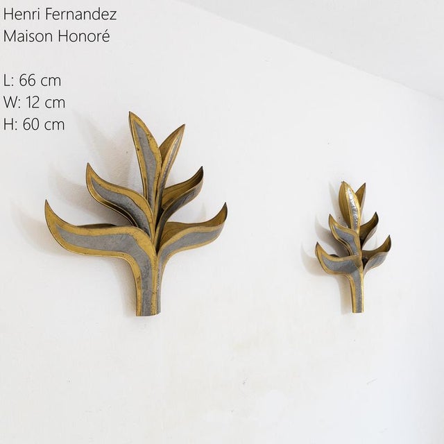 Description Pair of wall lamps designed by Henri Fernandez and produced by Maison Honoré. The structures have the shape of...