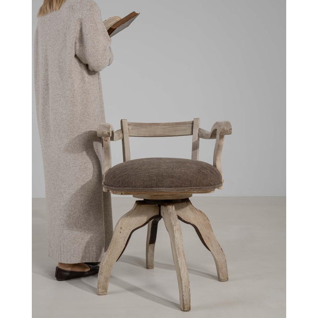 A armchair whose natural bleached oak, sculptural curved form gives it real character at first glance. It was made in...