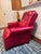 Bold red Naugahyde reclining chair that dates back to the 70s. In excellent condition for it's age. Solid and reclining...