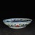 Beautiful Chinese wucai porcelain shallow bowl/plate hand-painted with vibrant dragon and phoenix motifs. A bold red...