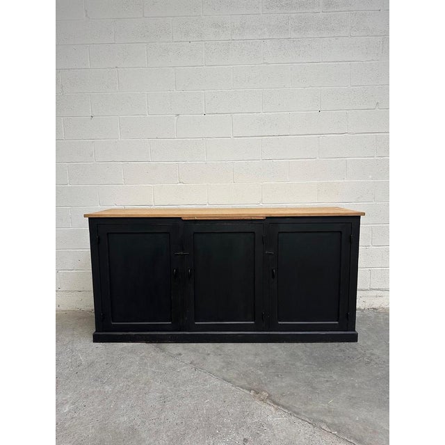 This antique cedar workshop cabinet has been fully restored. It features a beautiful raw wood top and a black patinated...