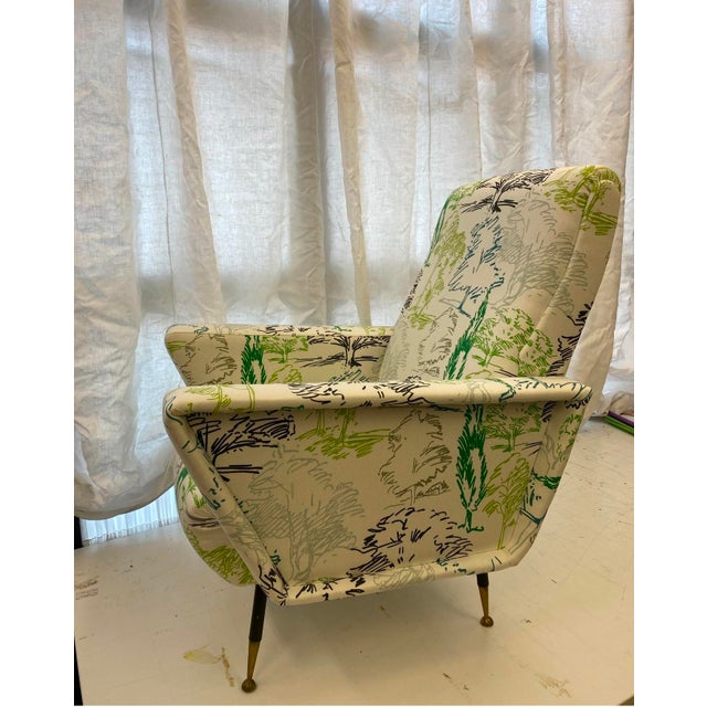 1970s armchair upholstered in Sanderson linen and printed cotton fabric This piece is attributed to the mentioned...