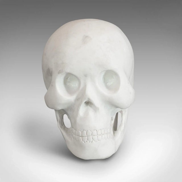 This is a vintage ornamental skull. An English, absolute white marble decorative desk or mantel ornament, dating to the...