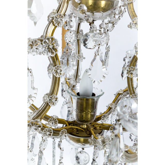 Created in the 1920's, this chandelier is beautiful example of the late 18th century Austrian Empress Maria Theresa style;...