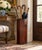 A handsome vintage wooden umbrella stand distinguished by its architectural octagonal form, warm reddish-brown finish, and...
