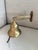 Old wall mount brass ship’s bell. The bell is approx 3.75” wide and it protrudes approx 6” from the wall when hung. A thin...