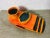 Handcrafted ceramic smoking set by Zsuzsa Heller with bright orange and black glaze, including an ashtray and cigarette...