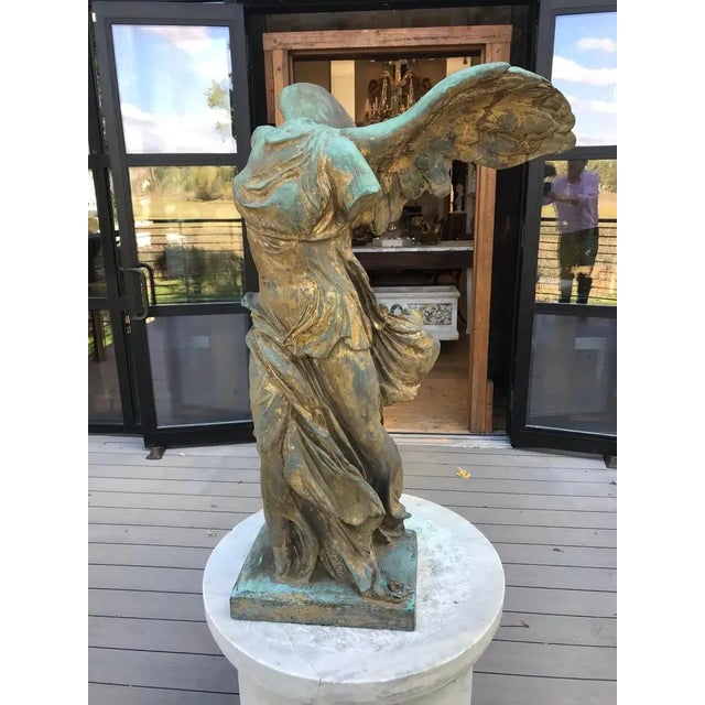 A 19th century French patinated bronze sculpture of the Nike of Samothrace. Copied from The Winged Victory of Samothrace,...