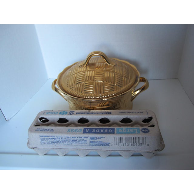 Large covered casserole dish in golden glo and a basketweave pattern. This pattern was sold exclusively by Gump’s, a...