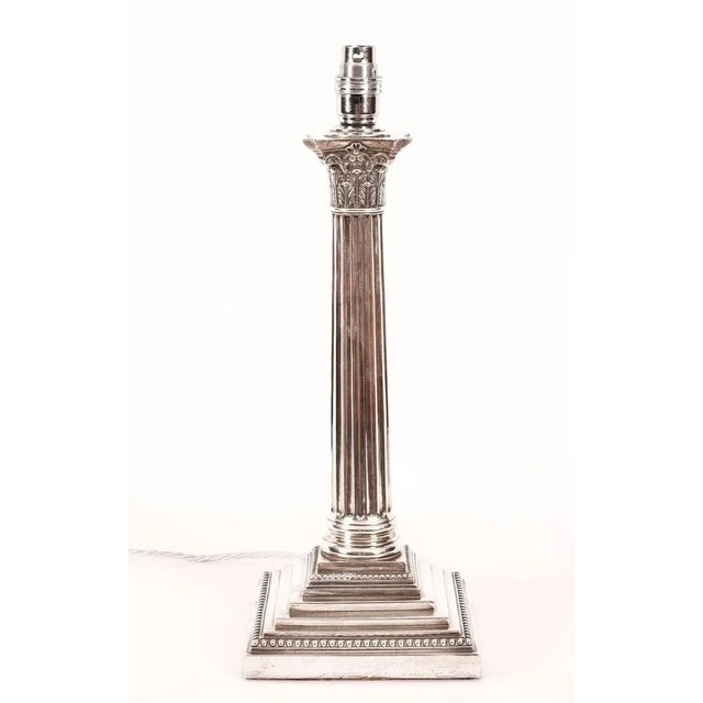 This is an impressive large antique Victorian sterling silver Corinthian column table lamp bearing hallmarks for London...