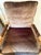 A Bobbin- frame lounge chair with natural oak finish and plush mocha velvet cushions. With tailored piping and sculptural...
