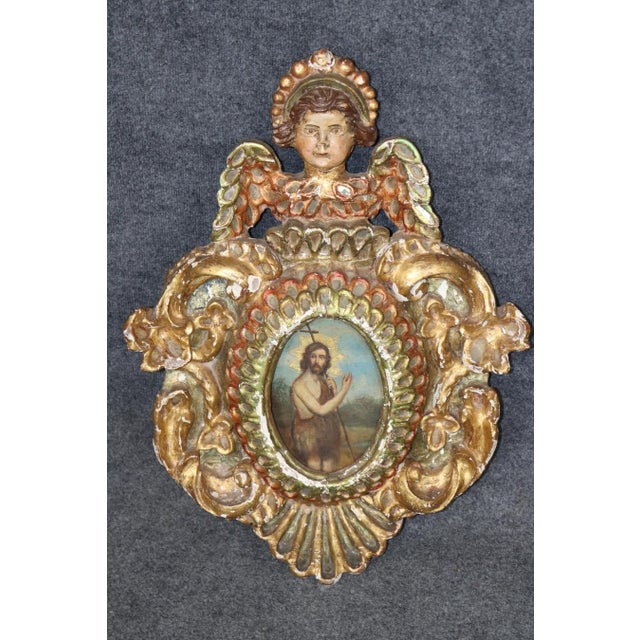 An extraordinary and beautifully preserved pair of antique religious reliquaries, these magnificent devotional pieces are...