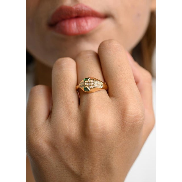 This is part of Chairish’s Fine Jewelry assortment. Statement Diamond and Natural Emerald Snake Head Ring in 18K Gold...