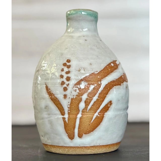 Beautiful vintage Japanese sake bottle, handmade and marked with the artist’s seal. Crafted in a rustic, natural Bizen...