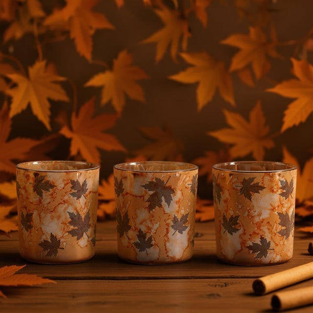 Warm up your home with the soft glow of this Autumn Leaf Glass Votive Holder Set. Featuring a beautiful marbled amber...