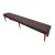 Large 9' Neoclassical upholstered bench with nail head details and fluted brown finished legs.
