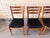 This set of six vintage dining chairs by the Danish manufacturer Farstrup features a striking graphic design with clean...