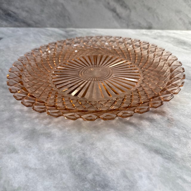 Depression Era Anchor Hocking beautiful pink glass cake plate. Platter features beautiful cut glass in a sunburst and...