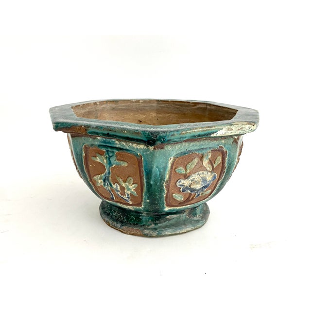 This 100+ year old low planter features six curved side panels with low relief with round medallions of flowers, birds,...