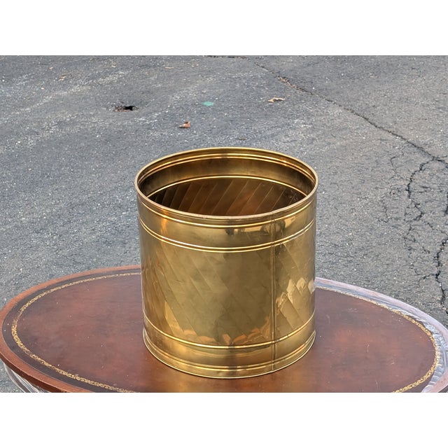 Add some 80s-era sophistication to your plant collection with this Brass barrel planter. Made in the USA, this round...