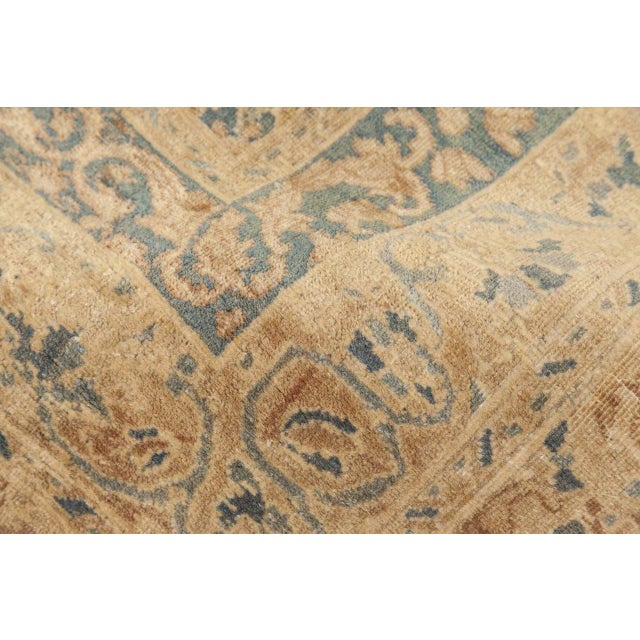 This stunning Persian Kerman rug draws the eye with its effortless elegance and complexity.Central field of the...