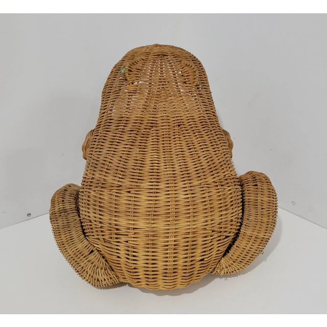 Charming oversized frog basket made of wicker with glass marble eyes. Can be used to hold some magazines or be used as an...