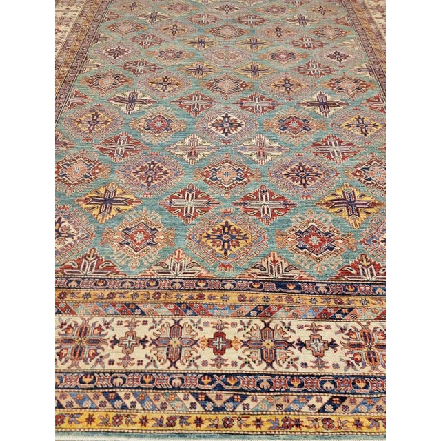 This particular Hand Knotted Fine Rug is made of 75% wool & 25% cotton, dyed with pigment from vegetables. This piece has...