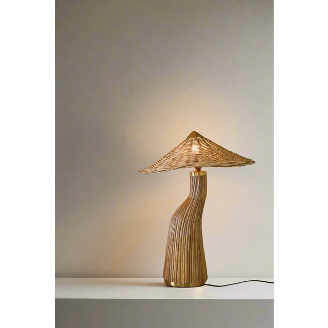 Illuminate your space with elegance and artistry with this mid century modern style pencil reed rattan table lamp....