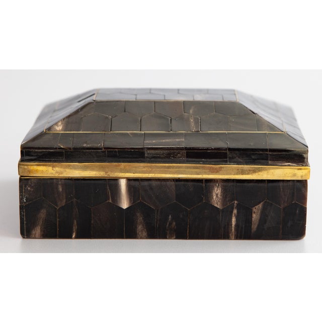 A stylish antique Art Deco English tortoise shell lidded box with gilt brass interior, circa 1920. A fabulous accent piece...