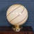 A striking Murano glass globe table lamp, produced in Venice, Italy, circa 1980. The large spherical shade is beautifully...
