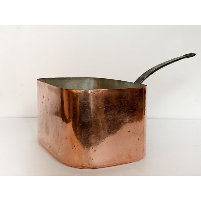 This vintage rectangular copper pot was crafted in France and is built to last. It has a lustrous exterior, an enameled...