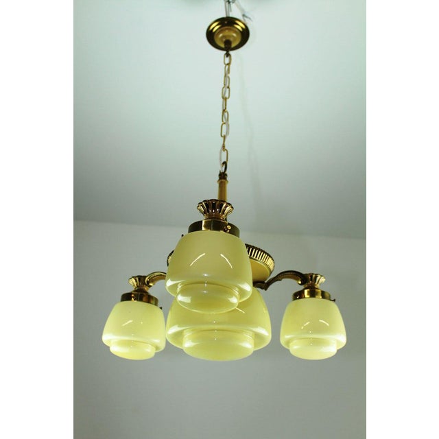 Brass, partly white lacquered beige, glass lampshades made of beige opal glass glossy, 4 sockets E27, original condition,...