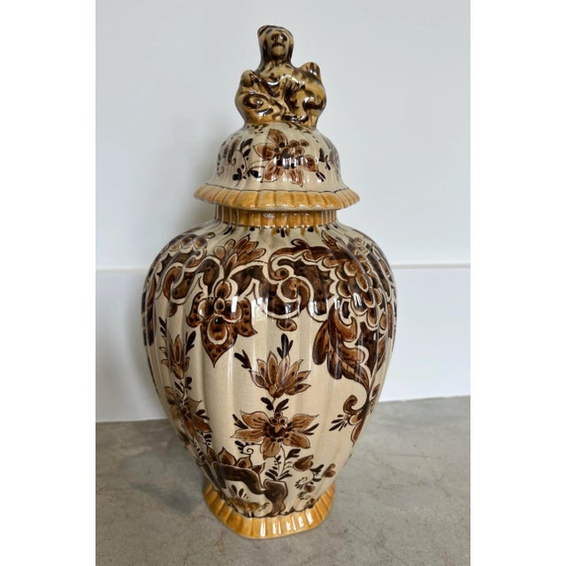A gorgeous vintage piece of Gouda Pottery. Hand-painted in Holland circa 1940, this lidded vase or urn in beautiful rich...