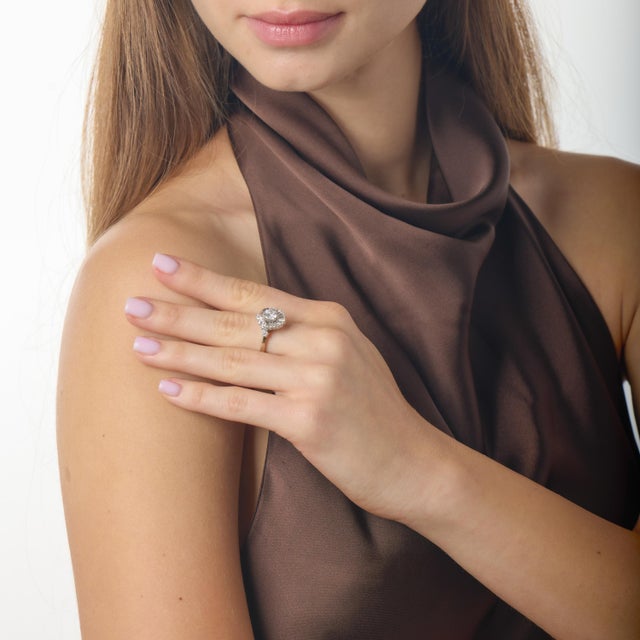 This sophisticated Mid Century diamond ring captures the elegance and confident glamour of 1960s design, showcasing a...