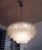 Elegant, large four-tier chandelier made of murano glass tubes on white lacquered frame. Chandelier illuminates...