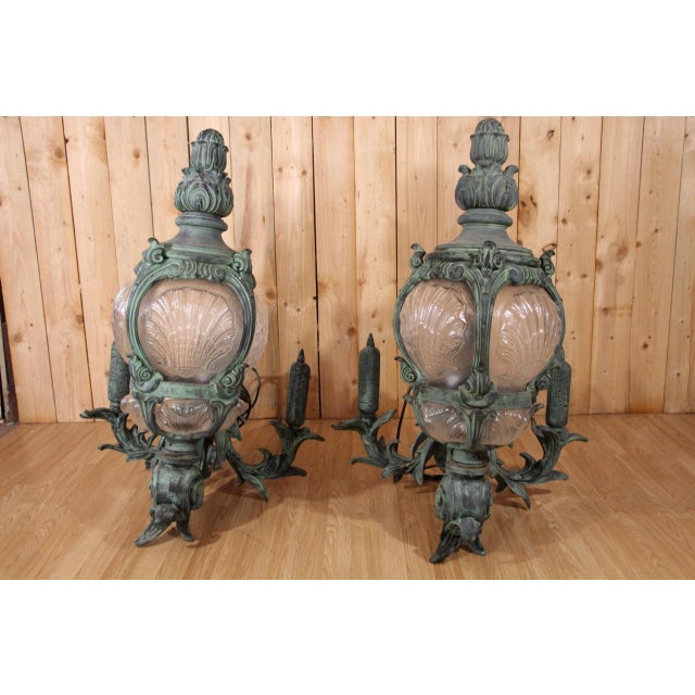 Beautiful pair of cast iron wall lights with bronze patina made based on models from the alexandre iii bridge in paris....