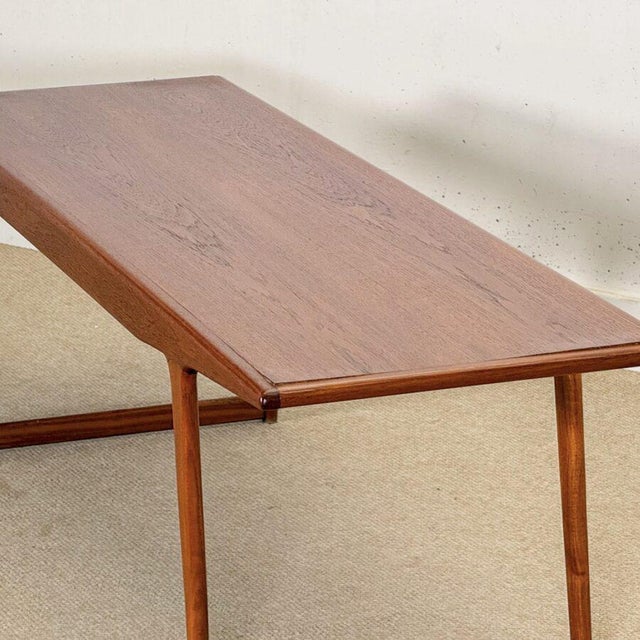 A beautifully proportioned Mid-Century coffee table designed by the renowned Danish designer Johannes Andersen and...