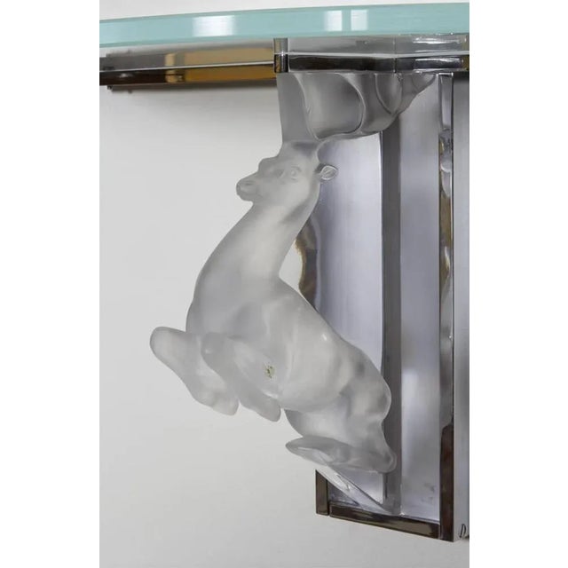 Deer console marc lalique (designer) marc lalique – 1900-1977 “cerf” console in satin glass and chromed steel support....