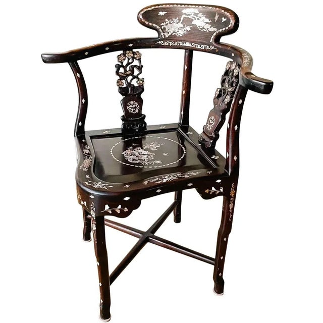 Beautiful vintage Chinese corner chair with intricate mother of pearl inlay hand carved of solid dark stain rosewood. It...
