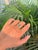 This elegant engagement ring features a 1.09 ct emerald-cut emerald, set in 14K yellow gold. The emerald measuring 7 x 5...