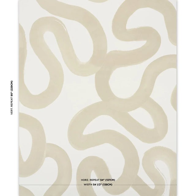 Hadiya Williams' Trace wallpaper in sand features a winding, gestural design based on an original acrylic painting. Its...