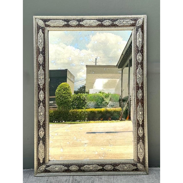 A magnificent vintage Moroccan wall mirror showcasing the exceptional craftsmanship and decorative artistry for which...