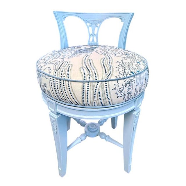 Charming vintage vanity stool newly refinished in Benjamin Moore Soft Sky Blue, featuring a sculptural wood frame with...