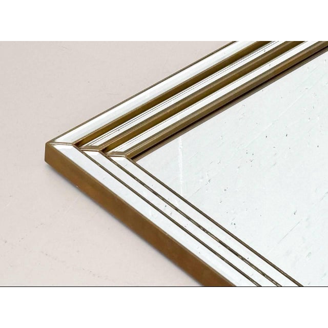 This wall mirror impresses with its clean geometry and elegant, minimalist design. The rectangular frame is made entirely...
