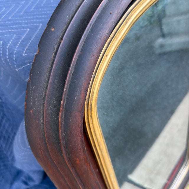 A Very Nice Antique Walnut Victorian Wall Mirror, Circa 1860s A handsome walnut-framed wall mirror with an arched top and...