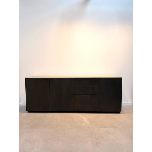Bring understated luxury into your home with this beautifully crafted contemporary sideboard. Finished in a rich dark...