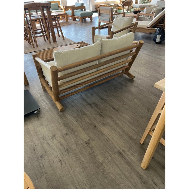 Experience the ultimate in sustainable luxury with the Havanna Double Sofa. Hand-carved from solid reclaimed teak, this...