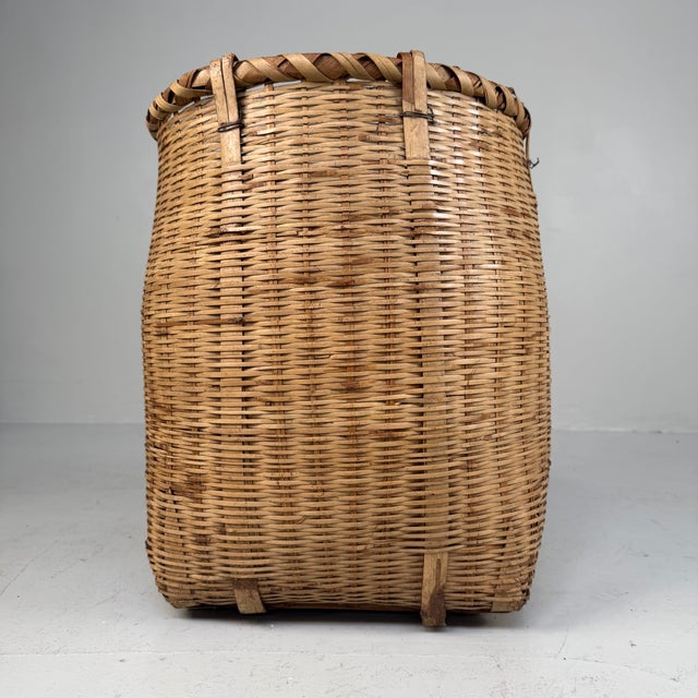 The basket has a warm natural tone and a refined, even weave that shows the quality of the craftsmanship beautifully. The...