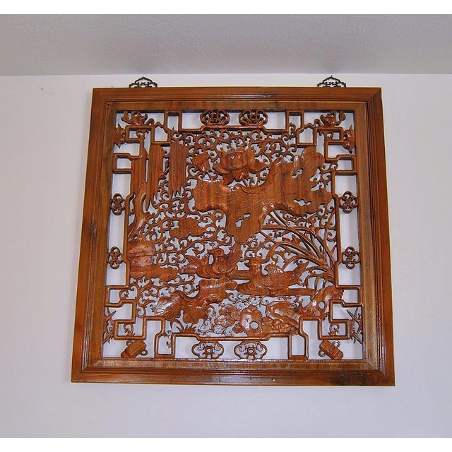 An authentic, antique, openwork Chinese Jumu Panel with lotus blossoms, ducks, auspicious motifs and scrolls carved in...